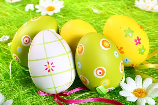 Painted Colorful Easter Eggs on green Grass