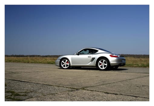 photo of a sports car at the racetrack