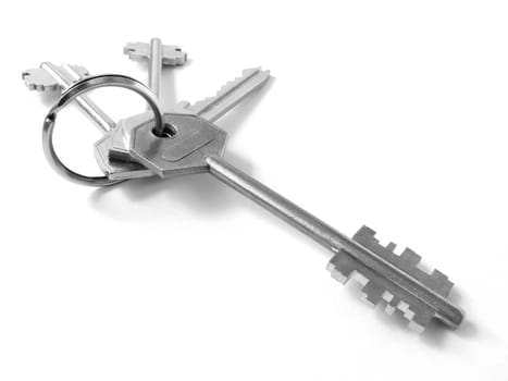 bunch of keys from door locks on the white background