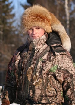The man in the winter afternoon on the nature