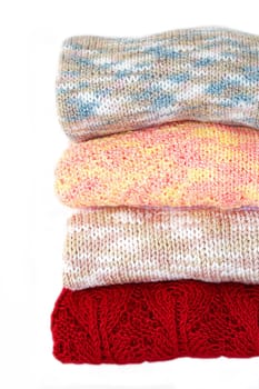 Hand made pullovers on white background