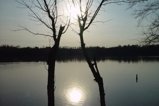 try to capture the sun and its reflection on the water.