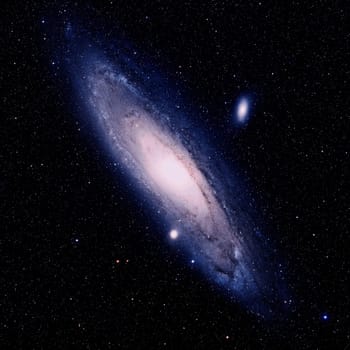 This is a true colour digital image of the great Andromeda nebula. It is a "spiral"" galaxy consisting of billions of stars like our sun. It is approximately 2.2 million ""light years"" from Earth. At 180,000 light years across it is a massive ""sister"" galax"