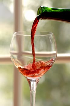 red wine poured into a glass