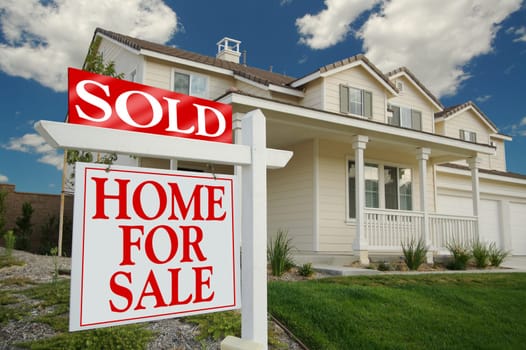 Sold Home For Sale Sign in front of Beautiful New Home.