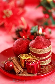 Festive tabletop or table decoration for Christmas time in red tone