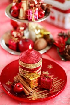 Festive tabletop or table decoration for Christmas time in red tone
