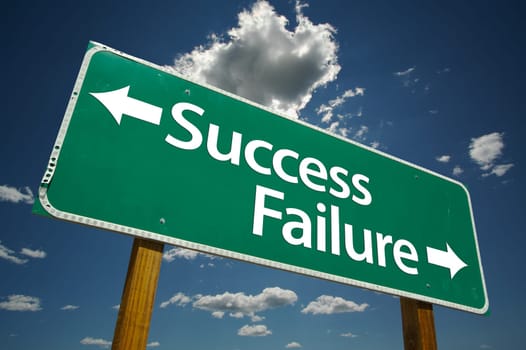 Success, Failure Road Sign with dramatic blue sky and clouds.