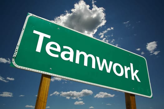 Teamwork Road Sign with dramatic blue sky and clouds.