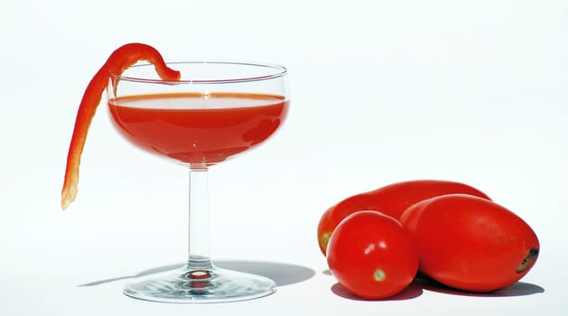 Highball glass with vegetable juice isolated. Bright and warm natural colors.