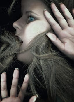 Woman trapped behind glass