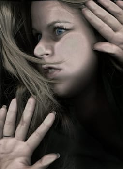 Woman trapped behind glass