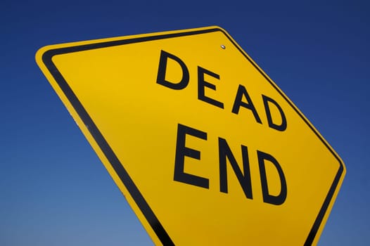 Abstract View of Dead End Sign with Blue Sky