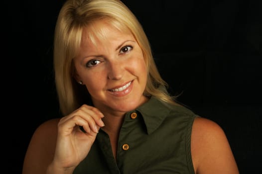 Attractive Blond Haired, Brown Eyed Woman on a black background.