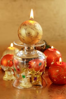 Beautiful Christmas candles in golden and red tones as decoration