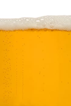 A macro image of a glass of beer.