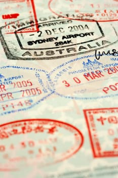 Macro / selective focus image of passport stamps.  Focus is on the word Australia.