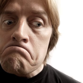 A sad sad man with huge frown.  Desaturated for an even sadder feel.