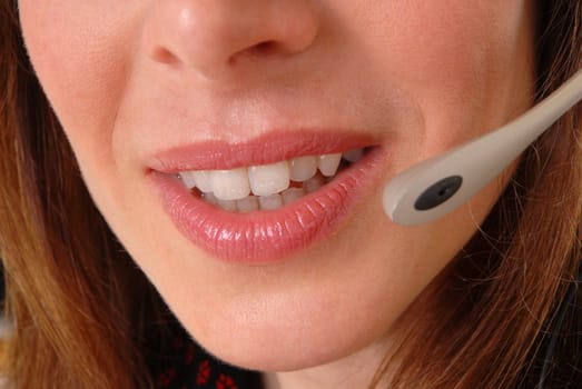 young woman telephone operator close up of beautiful lips/teeth isolated on white