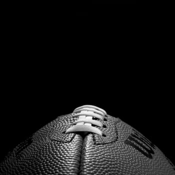 Close up of a football in black and white.