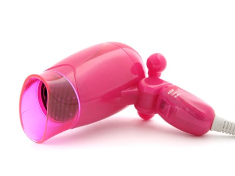 compact pink hairdryer at the white background