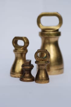 Assorted weights used on old fashioned cooking scales