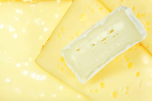 Delicious cheeses as background