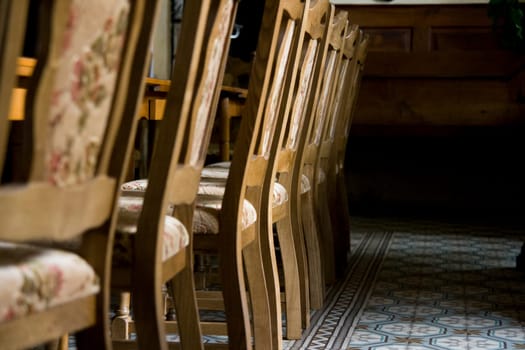 Old chairs in empty room.