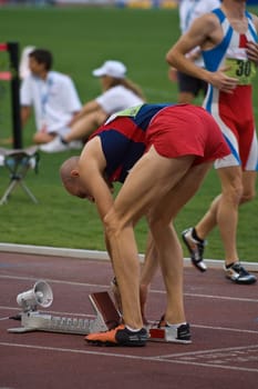 A professional runner, preparing for the start