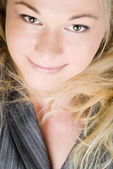 Elegant businesswoman wearing a suit. Blond long hair.