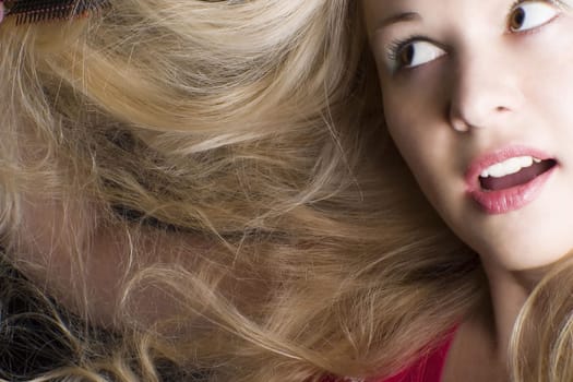 Learn to love your hair. Young woman with long blond hair