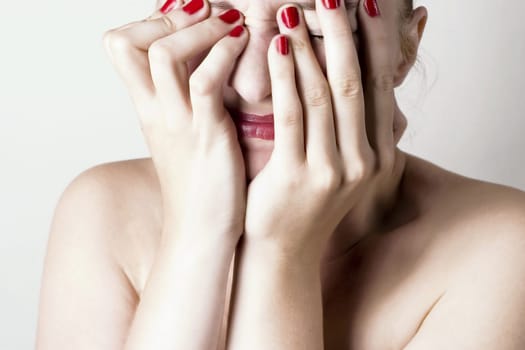 Beautiful sensual woman with headache/ pain. White background.