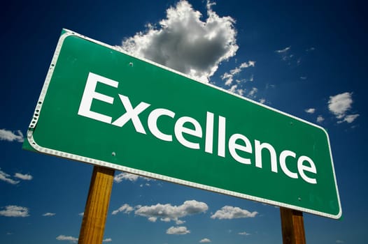 Excellence Road Sign and dramatic clouds and sky.