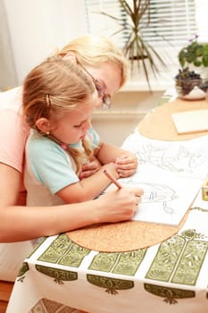 Mother and child paint together