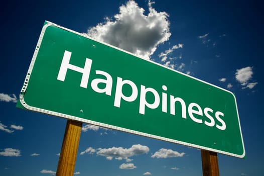Happiness Road Sign and dramatic clouds and sky.