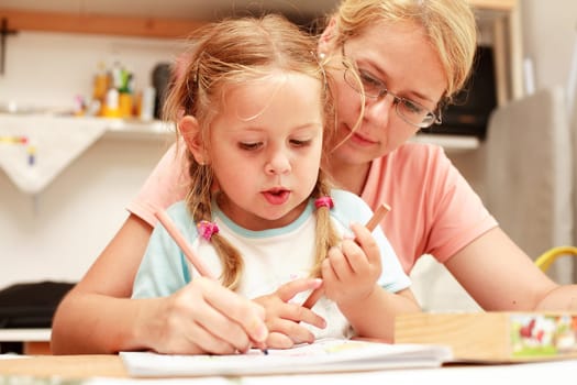 Mother and child paint together