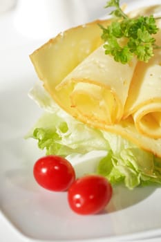 Two cheese rolls with salad and tomato