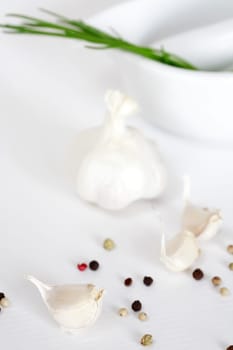 Garlic and pepper on white background