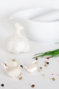 Garlic and pepper on white background