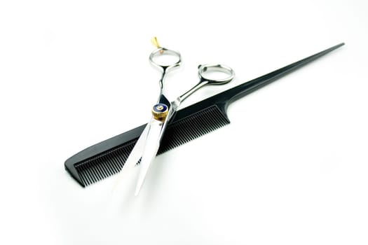 steel scissor w/ comb on white background