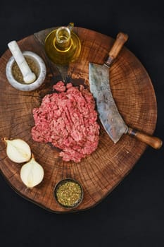 Making fresh raw pork mince meat with chopping knife, top view