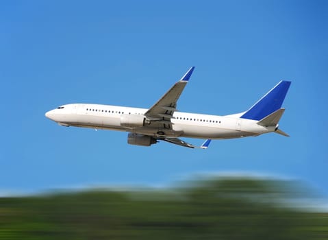 Jet airplane taking off with motion blur