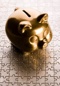 Piggy bank on jigsaws & on the colorfull background