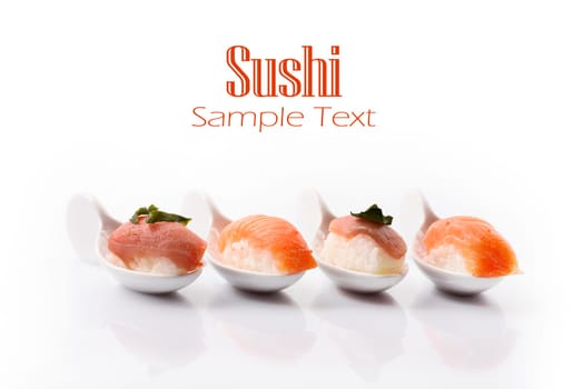 Closeup of traditional japanese sushi set with salmon and tuna fish  isolated on white background. Sushi bar menu design with copyspace.