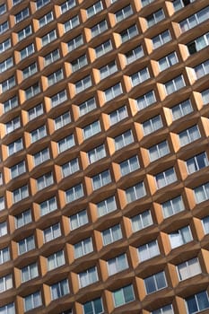 Curtained windows of a tall building in Bulgaria.