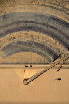The dirty back window of an off-road sport utility vehicle.  Background image for off-road adventure.