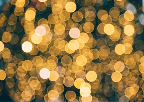 Golden blur background. Christmas holiday natural bokeh with defocused night lights.