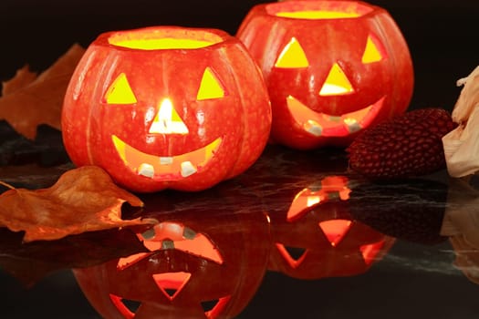 Halloween still life with small candle-lights