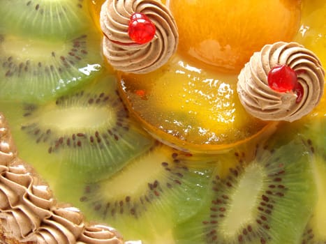 cake fragment with cream and fruits slices in jelly
