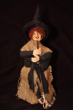 Witch with broom and hat. Isolated.  Horror, halloween, fantasy photo.